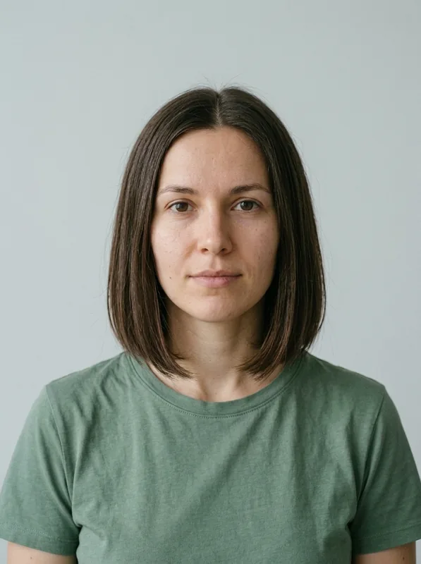 The same fictional portrait edited to a chin-length dark brown bob
