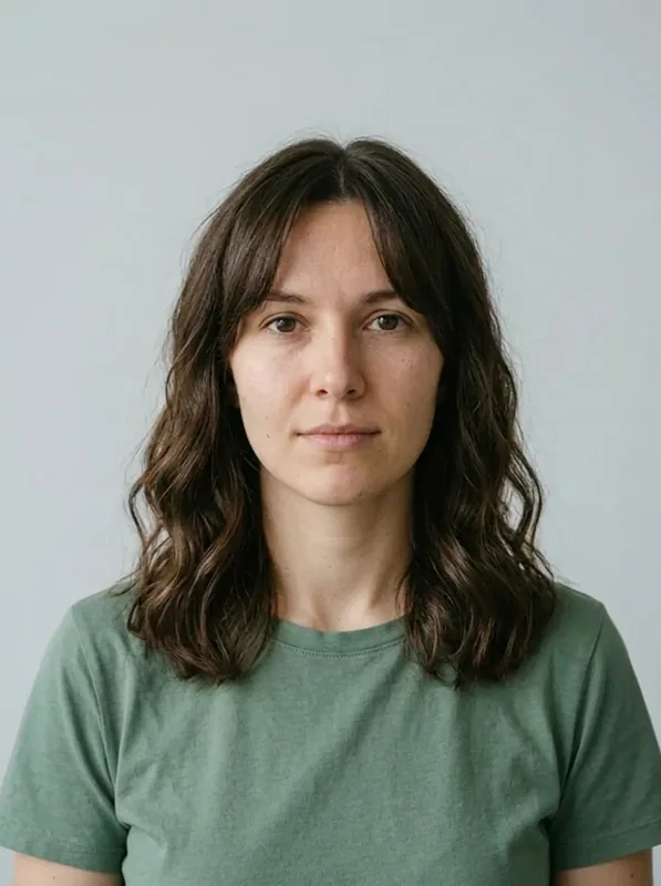 Curtain Bangs and Waves preview on the same fictional woman in a green shirt