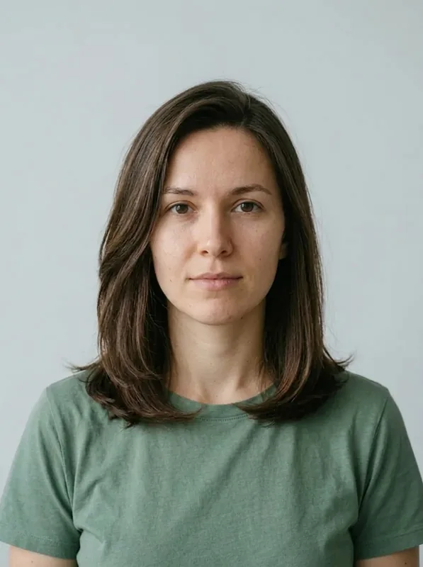 Shoulder-Length Layered Lob preview on the same fictional woman in a green shirt