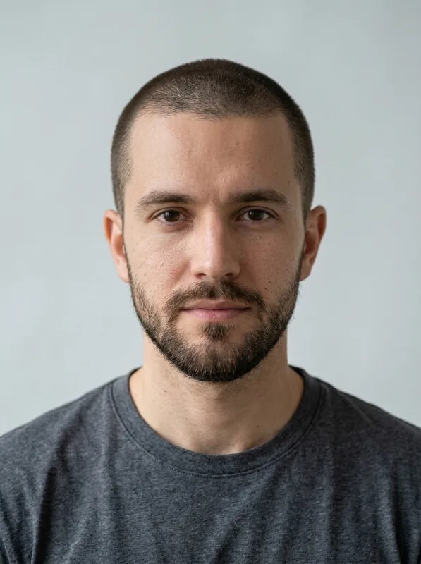 Classic Buzz Cut preview on the same fictional man with a beard in a charcoal shirt